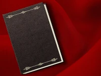 Modello di Writer per la scrittura di libri Libro in pelle adagiato su un panno rosso. Un modello di LibreOffice Writer per libri, ricco di opzioni e facilmente personalizzabile